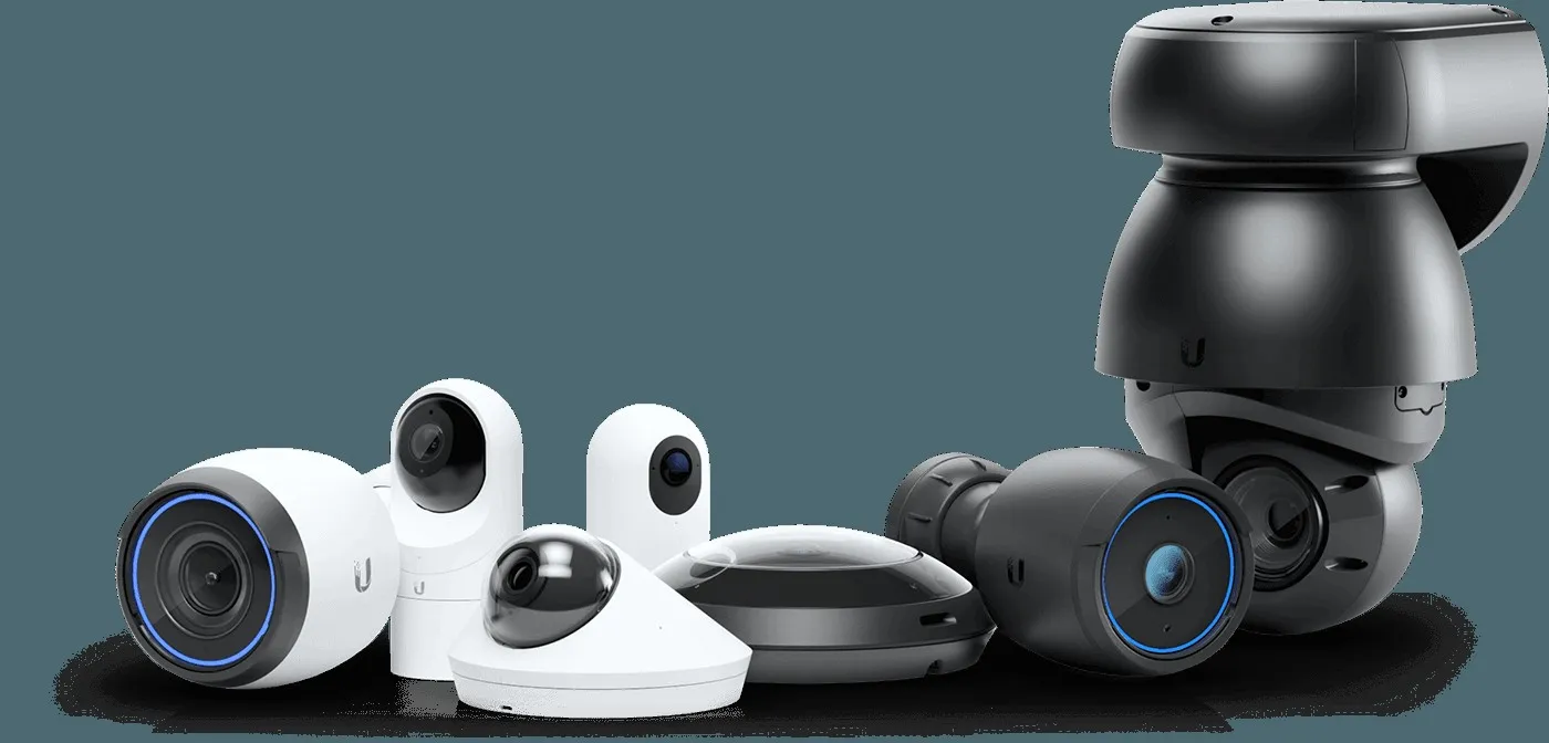 Lineup of Ubiquiti Protect security cameras and sensors, including bullet, dome, and pan-tilt-zoom models, grouped together against a white background.